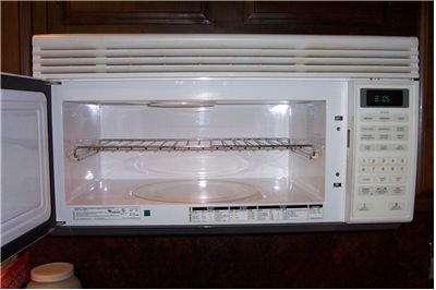 Picture Of Microwave Oven With A Metal Shelf